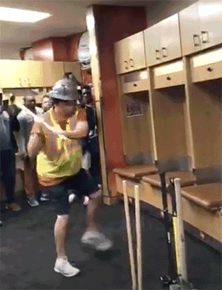 Tom Herman wielding a sledgehammer badly